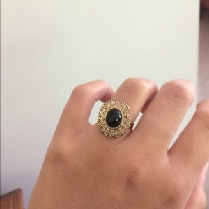 Gold ring with black stone
